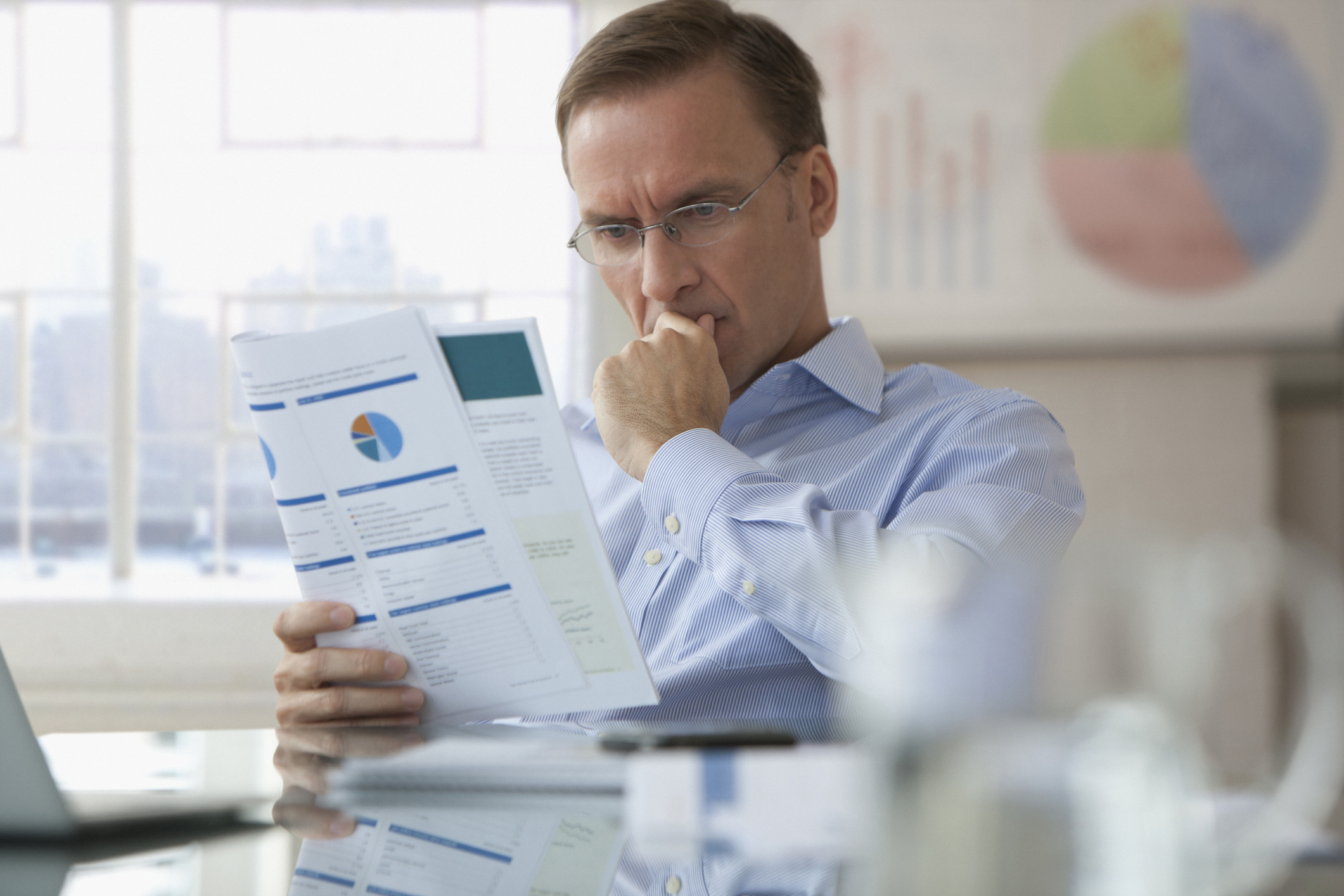 Technology delivery expert scrutinising a candidate assessment report — candidate photo for Colibrí Assure